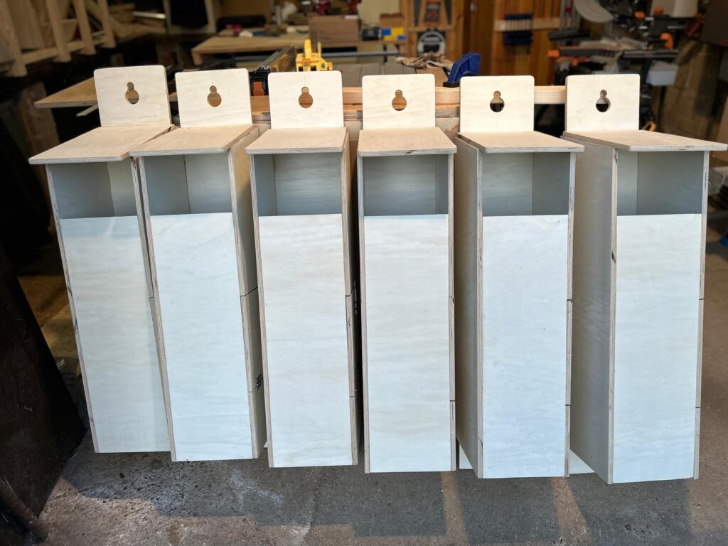 A row of unpainted Tawny Owl boxes